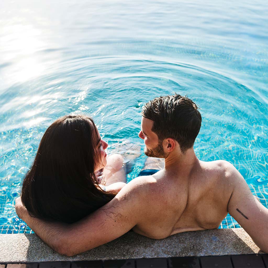 Couple sitting in a eco pool
